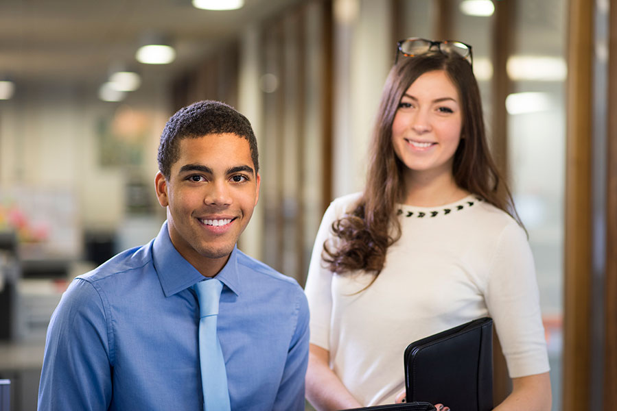 two young interns enjoying their work