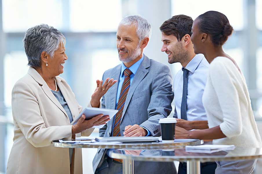 team members smiling and laughing while interacting