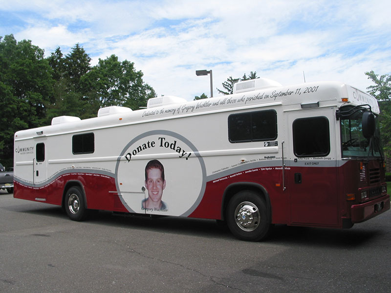a large vehicle that says Donate Today