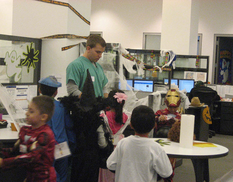 man and children in costumes